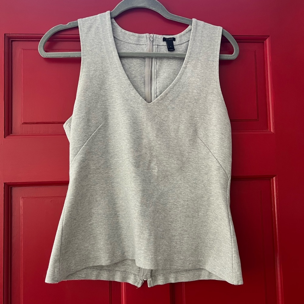 JCrew basic gray knit too, back zip. Slight peplum waist size S